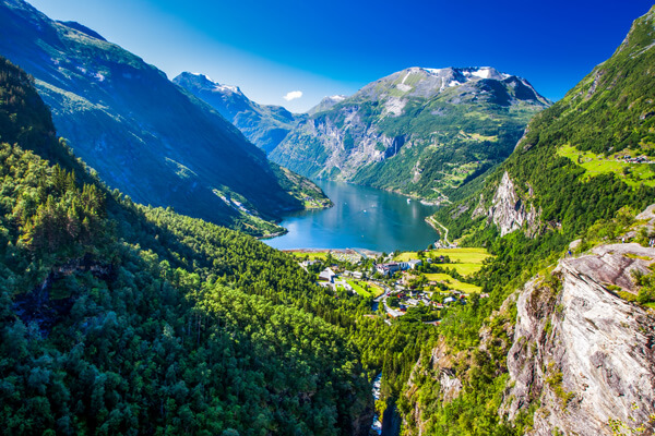 Scenic cruise ship navigating Nordic Fjords